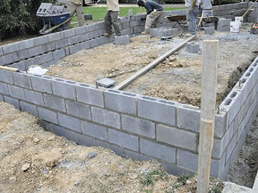 Professionals building a foundation with blocks in Austin, TX